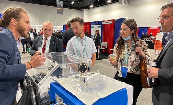 Medtronic’s Will Riseley demonstrates surgical smoke evacuation equipment.