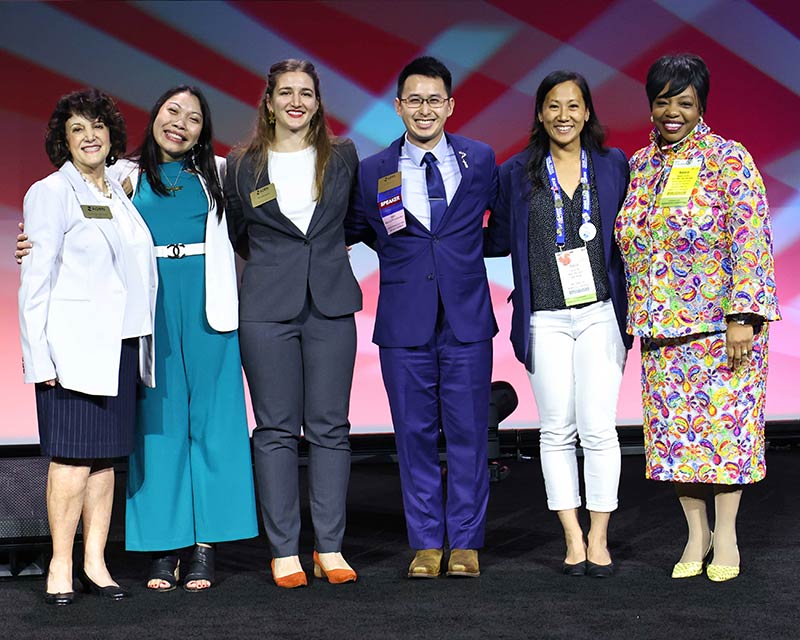 A group of people pose for a picture.