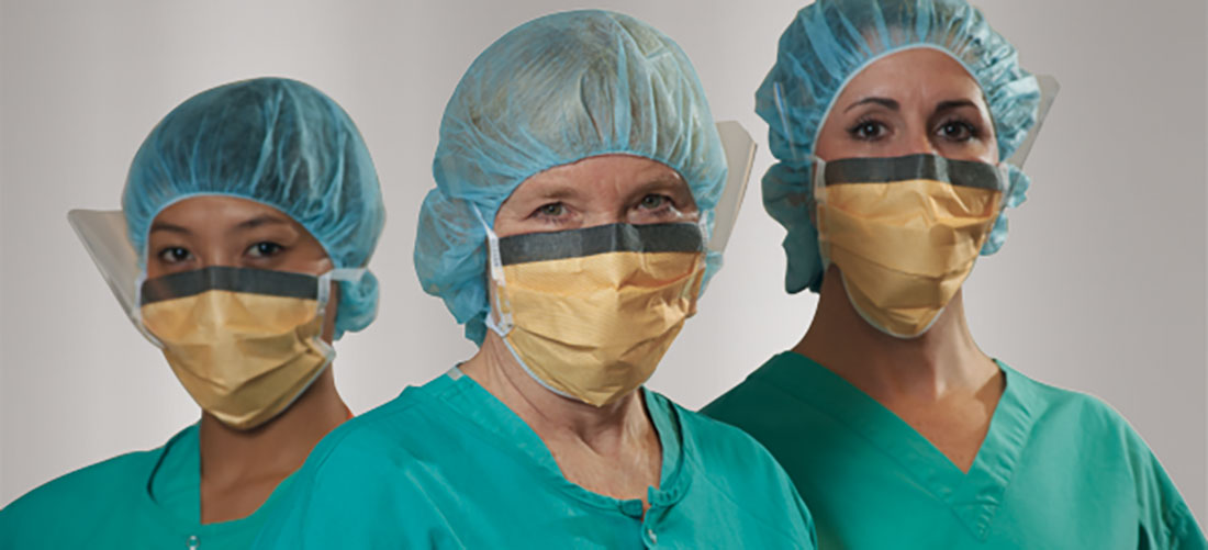 Three Periop nurses with masks and bouffant caps.