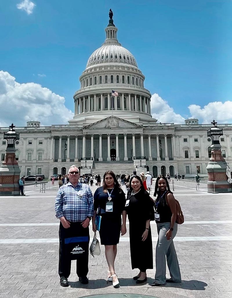 Group of people standing in front of Capitol Hill