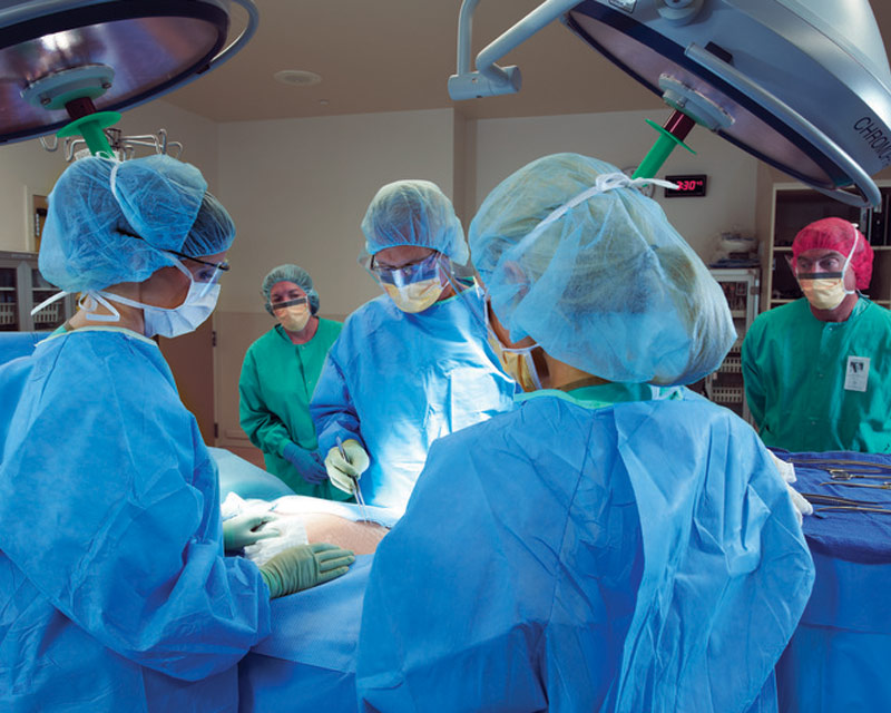 associate-surgical-team-gathered-during-procedure surgical team gathered during procedure