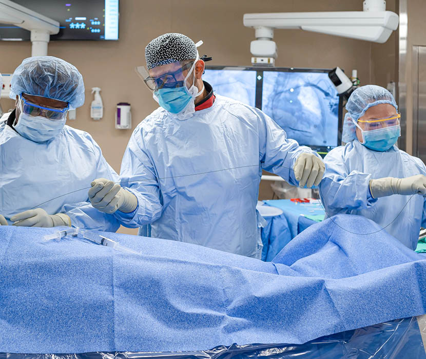 Nurses work during a surgery.