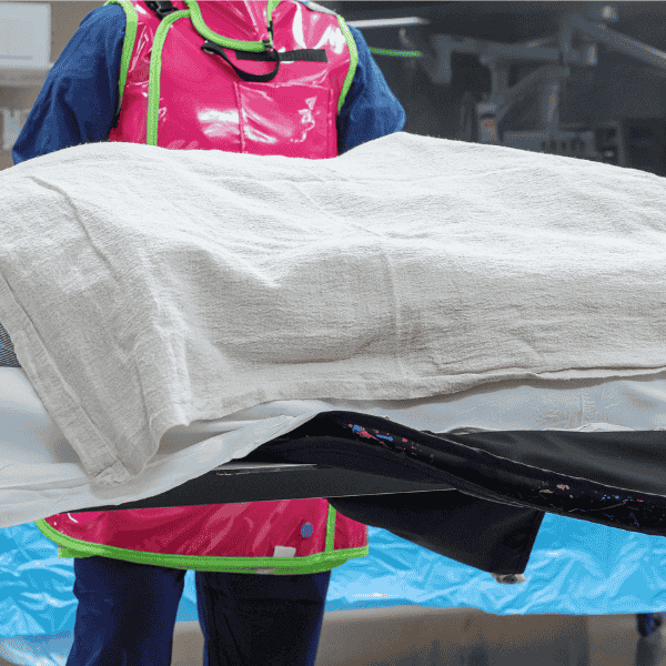 radialogy-tech-with-patient person wearing protective garments