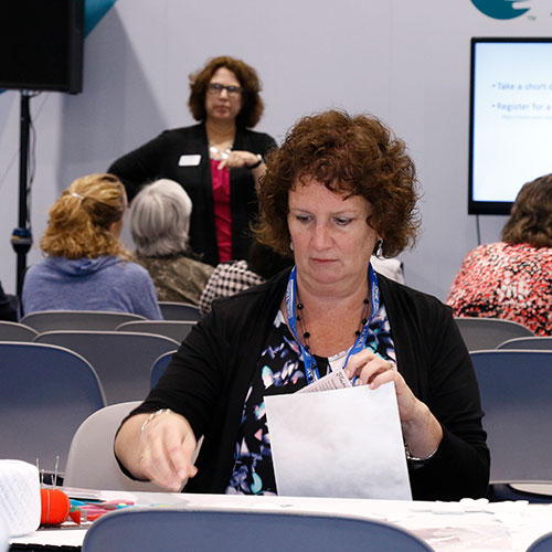 Two people talking in the Expo Hall at AORN Surgical Expo.
