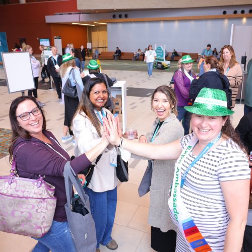 First-Time-lounge Expo attendees giving high-fives