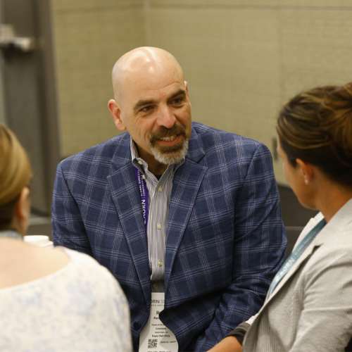 Specialty-Assembly-Meet-Up-500x500 Conference attendees engaged in conversation and networking with peers.