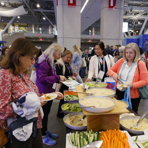 expo-hall-education AORN Expo Hall Attendees snack on veggies at the Expo Hall reception.