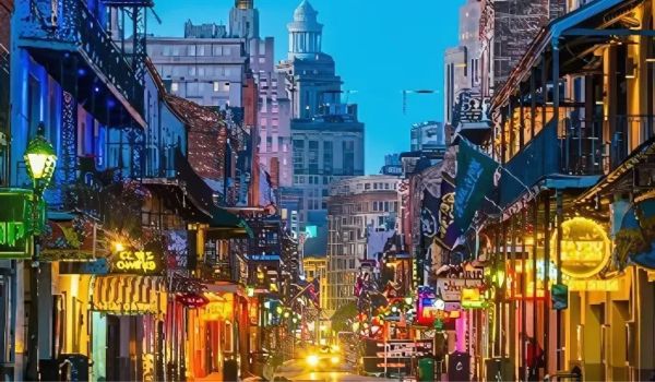 Lively city street at night with neon signs