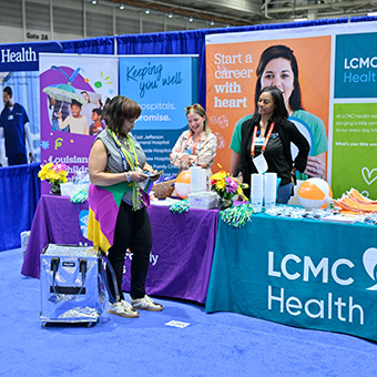 Expo attendees at booth