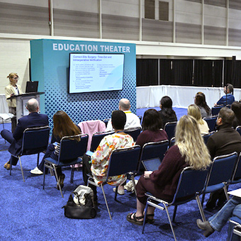 Group of Expo attendees at Education Theater.